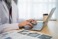 Close up hand. Muslim islam Asian doctor man wearing hijab and stethoscope working with laptop computer. Female doctor work at Royalty Free Stock Photo