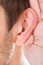 Close-up of hand near ear