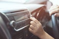 Close up hand open car radio listening. Car Driver changing turning button Radio Stations