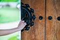 Close up hand open Chinese wooden door Royalty Free Stock Photo