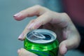 Close up of a hand opening a beverage Royalty Free Stock Photo