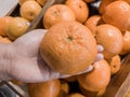 Close up Hand and Oranges in market.mandarin oranges raw Fruit,Fresh mandarin oranges texture Royalty Free Stock Photo