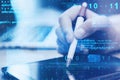 Close up of hand with pen using digital tablet at desktop with abstract glowing blue coding background. Binary code, technology, Royalty Free Stock Photo
