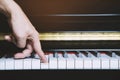 Close up of hand people man musician playing piano keyboard with selective