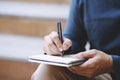 Close up hand people man are sitting on a staircase. using pen writing Record Lecture note pad. Leave space to write messages. Royalty Free Stock Photo