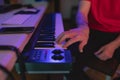 Close-up of a hand of a pianist and producer playing keyboard Royalty Free Stock Photo