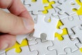 Close up of hand place missing jigsaw puzzle representing problem solving skill Royalty Free Stock Photo