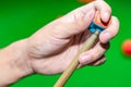 Close up hand player snooker using chalk rubbing a cue Royalty Free Stock Photo