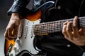 Close up hand playing electric guitar. Musician playing guitar, live music. Man playing guitar. Musical instrument Royalty Free Stock Photo