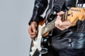 Close up hand playing guitar. Musician playing guitar, live music. Musical instrument. Electric guitar. Repetition of Royalty Free Stock Photo