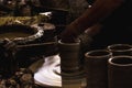 Close up hand of potter do a clay vase thai style on a potter`s wheel in pottery villages at Ko Kret, Nonthaburi province, Royalty Free Stock Photo