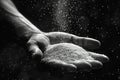 Close-up of a hand pouring sand through fingers symbolizing time Royalty Free Stock Photo