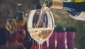 Pouring wine into a glass Royalty Free Stock Photo