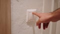 Close Up of Hand Pressing Button to Switch on the Light Royalty Free Stock Photo