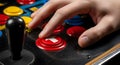Close-up of Hand Pressing Red Arrow Button on Vintage Arcade Game Machine Royalty Free Stock Photo