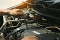 Close up of hand professional mechanic repairing a car in auto repair shop Royalty Free Stock Photo