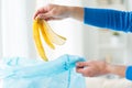 Close up of hand putting food waste to rubbish bag Royalty Free Stock Photo