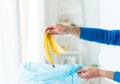 Close up of hand putting food waste to rubbish bag Royalty Free Stock Photo