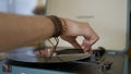 Close-up of hand putting record in vinyl player. Action. Man puts vintage record in modern stylish record player Royalty Free Stock Photo