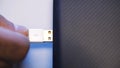 Close up of hand putting USB cable into external hard disk  on white background. Media. USB cable for Royalty Free Stock Photo