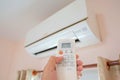 Close up hand and remote control air condition Royalty Free Stock Photo