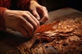 close-up of hand rolling a tobacco cigarette