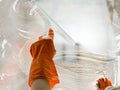 close up hand with rubber glove cleaning window. High quality beautiful photo concept Royalty Free Stock Photo