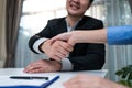 Close up hand of Salesman banker handshake with investor girl