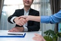 Close up hand of Salesman banker handshake with investor girl for loan insurance investment after negotiation for Business deal an