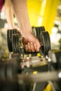 Close up. Hand of senior man. Holding weight. Man workout in the Royalty Free Stock Photo