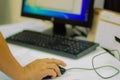 Close up hand of software engineer on mouse during testing program computer. Information technologist during repair PC computer i Royalty Free Stock Photo