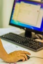 Close up hand of software engineer on mouse during testing program computer. Information technologist during repair PC computer i Royalty Free Stock Photo