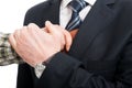 Close-up of hand stealing wallet from jacket pocket Royalty Free Stock Photo