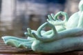 Close up hand. Stone frog doing yoga outdoor. Zen relax and relaxation yoga at the nature background Royalty Free Stock Photo