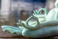 Close up hand. Stone frog doing yoga outdoor. Zen relax and relaxation yoga at the nature background Royalty Free Stock Photo