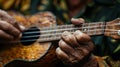 Close-up of a hand strumming a ukulele showcasing music