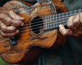 Close-up of a hand strumming a ukulele showcasing music