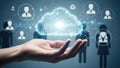 Hand holding glowing cloud with network of people icons, representing cloud computing and business network Royalty Free Stock Photo