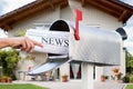 Hand Taking Newspaper From Mailbox Royalty Free Stock Photo