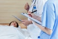 Close up hand taking notes checking up women patient symptoms on clipboard. Female doctor taking notes examining patients woman Royalty Free Stock Photo