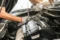 Close-up hand technician auto mechanic using the wrench to repairing change spare part car