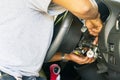 Close up hand of technician during repair key or switch engine start of sedan car Royalty Free Stock Photo