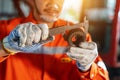 Close up hand of technician use vernier caliper and holding of bulldozer sprocket to inspection and repair maintenance heavy Royalty Free Stock Photo