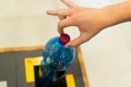 Close up hand throwing empty plastic water bottle into recycling bin, recycle rubbish Royalty Free Stock Photo