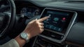 Close up of hand touching car dashboard screen Royalty Free Stock Photo