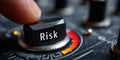 Close up hand turning risk button on control panel, concept of decision making, uncertainty, and business strategy Royalty Free Stock Photo