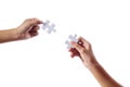 Close up hand two people holding jigsaws connecting Royalty Free Stock Photo