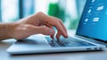 Close-up of a Hand Typing on a Laptop Keyboard