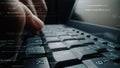 Close-Up of a Hand Typing on a Laptop Keyboard with Programming Code Overlay, Depicting Technology, Coding, and Digital Royalty Free Stock Photo