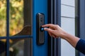 Close up of hand unlocking smart door with modern design and touch security system features